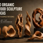 A horizontal banner titled "7 3D Organic Wood Sculpture Ideas That Defy Expectations." The image displays seven diverse abstract wooden sculptures on black bases against a dark grey wall. The sculptures feature flowing organic shapes, including twisted flame-like pillars, a porous, weather-worn piece with natural voids, smooth rings, and hollowed-out biomorphic forms that showcase rich grain patterns. Text reads: "Sculptural Art That Demands to Be Experienced."