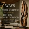Horizontal Pinterest graphic featuring an abstract organic timber sculpture on the right, displayed on a black metal base over a rustic wooden block. The sculpture highlights natural wood grains, smooth curves, and hollow openings. On the left, stylish text reads "7 WAYS A TIMBER SCULPTURE That Celebrates THE RAW BEAUTY OF WOOD CAN TRANSFORM YOUR SPACE". The background showcases a warm, minimalist living room with neutral seating, wood elements, and large windows. Includes woodzaa.com at the bottom.