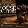 A hand-carved dark wood mouse figurine sitting upright on a rustic wooden table, facing right with paws tucked. Large text on the left reads "DARK WOOD MOUSE SCULPTURE - TINY CARVING, HUGE CHARM" and "7 Irresistible Finishes That Make This Miniature Masterpiece a Must-Have." A gold circular badge states "7 STUNNING FINISHES TIMELESS BEAUTY." The bottom banner features the Woodzaa logo, tagline "Carved by nature, made to inspire," and website woodzaa.com.